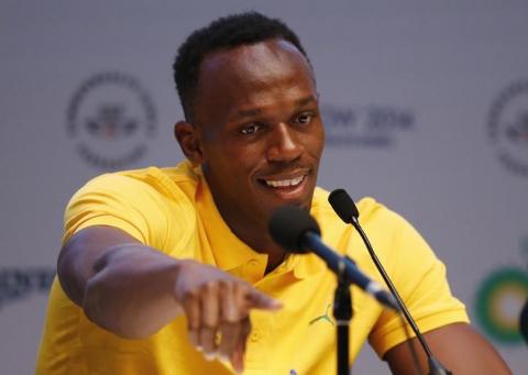 Jamaica's Usain Bolt speaks at a news conference in Glasgow, Scotland July 26, 2014. PHOTO BY REUTERS/Phil Noble