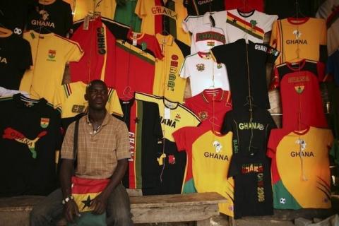 A street vendor waits for customers at his memorabilia stall in Accra, Ghana, file. PHOTO BY REUTERS/Siphiwe Sibeko