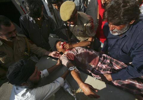 Surjeet Kumar, who locals said was injured during the recent exchange of fire between India and Pakistan, is rushed to a hospital in Jammu