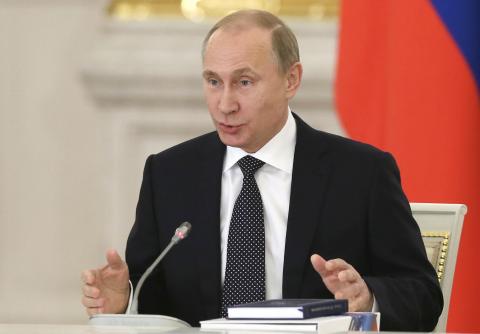 Russia's President Vladimir Putin speaks during a meeting of the State Council and the Presidential Council for Culture and Art, at the Kremlin in Moscow, December 24, 2014. PHOTO BY REUTERS/Sergei Ilnitsky