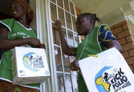 Volunteer Health officials wait to immunise children at a school in Nigeria's capital Abuja, February 1, 2010. PHOTO BY REUTERS/Afolabi Sotunde