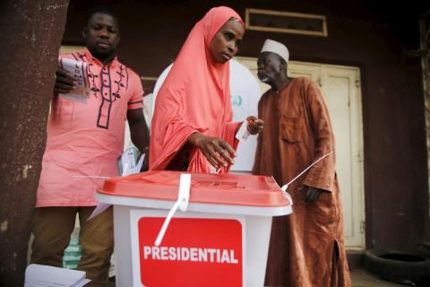 A woman casts her vote at a polling unit in Daura, northwest Nigeria, March 28, 2015. PHOTO BY REUTERS/Akintunde Akinleye
