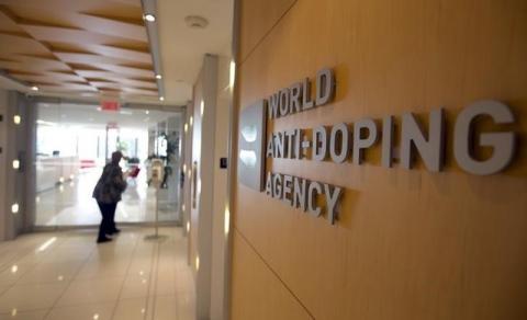 A woman walks into the head office for the World Anti-Doping Agency (WADA) in Montreal, November 9, 2015. PHOTO BY REUTERS/Christinne Muschi