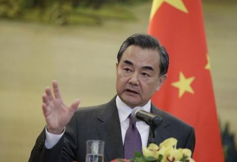China's Foreign Minister Wang Yi speaks at a joint news conference with British Foreign Secretary Philip Hammond (not seen) after a meeting at the Ministry of Foreign Affairs, in Beijing, China, January 5, 2016. PHOTO BY REUTERS/Jason Lee
