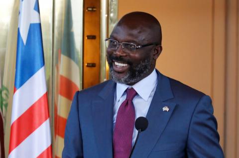 Liberia's President George Weah laughs during a news conference at Presidential palace in Abidjan, Ivory Coast, April 4, 2018. PHOTO BY REUTERS/Thierry Gouegnon