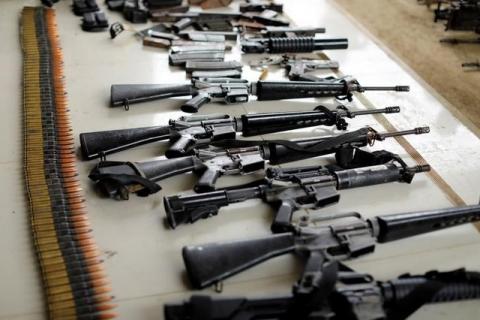 Combat seized weapons are display by Philippines army during a news conference, as government troops continue their assault against insurgents from the Maute group in Marawi city, Philippines July 4, 2017. PHOTO BY REUTERS/Jorge Silva