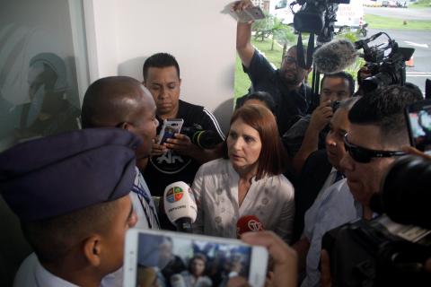 Marta de Martinelli, wife of former Panama president Ricardo Martinelli, speaks to an official while waiting for his extradition from U.S. outside the Panama Pacifico international airport in Panama City, Panama June 11, 2018. PHOTO BY REUTERS/Carlos Lemos