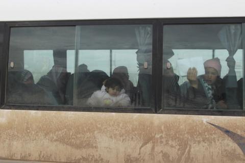 A woman demonstrates a medical permission as she and other Syrians attempt to enter Turkey at the Bab Al-Salam border crossing in northern Aleppo countryside, Syria, January 18, 2016. PHOTO BY REUTERS/Abdalrhman Ismail