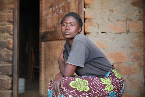 Tanzanian widow Rosemary Cyprian sits outside her home on Ukerewe Island, Feb 24, 2017. PHOTO BY REUTERS/TRF-Katy Migiro