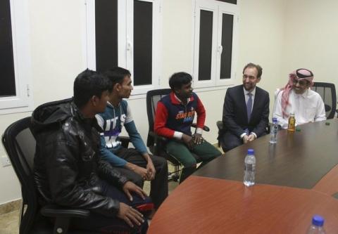 United Nations High Commissioner for Human Rights Zeid Ra'ad Al Hussein (2nd R) meets migrant workers during a tour of Labor City, Qatar, January 13, 2016. PHOTO BY REUTERS/Naseem Zeitoon