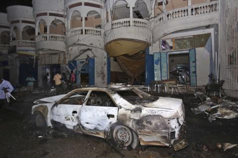 The wreckage of a vehicle after an explosion took place outside the Oromo restaurant in Mogadishu