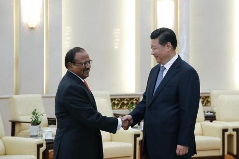 Chinese President Xi Jinping (R) shakes hands with India's National Security Adviser Ajit Doval at the Great Hall of the People in Beijing, September 9, 2014. PHOTO BY REUTERS/Lintao Zhang