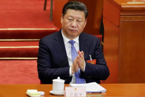 China's President Xi Jinping claps during the opening session of the National People's Congress (NPC) at the Great Hall of the People in Beijing, China, March 5, 2017. PHOTO BY REUTERS/Jason Lee