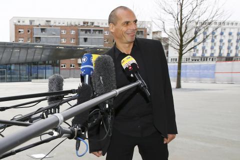 Greek Finance Minister Yanis Varoufakis smiles as he speaks to media outside the European Central Bank (ECB) in Frankfurt, February 4, 2015. PHOTO BY REUTERS/Kai Pfaffenbach