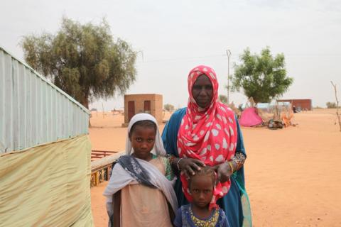 Aminetou Mint Yarg poses with family members in the commune of Dar El Barka, Mauritania, October 20, 2018. PHOTO BY Thomson Reuters Foundation/Nellie Peyton