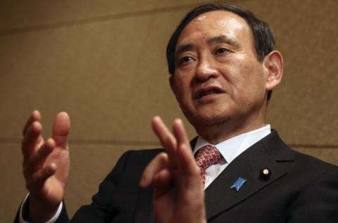 Japan's Chief Cabinet Secretary Yoshihide Suga speaks during an interview with Reuters in Tokyo, February 15, 2014. PHOTO BY REUTERS/Yuya Shino