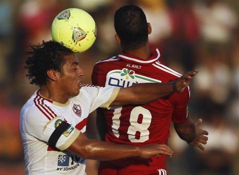 Zamalek's Hany Saied (L) fights for the ball against derby rivals Al Ahly's El Sayed Hamdy