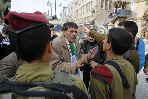 TURMUSIYA, West Bank (Reuters) - A Palestinian minister died shortly after being hit by Israeli soldiers during a protest on Wednesday in the occupied West Bank, a Reuters photographer who witnessed the incident and a Palestinian medic said.  Ziad Abu Ein, a minister without portfolio who was in his early 50s, was rushed by ambulance from the scene, in the village of Turmusiya, but died en route to the nearby Palestinian city of Ramallah.  Palestinian President Mahmoud Abbas, in a statement, called Abu Ein'