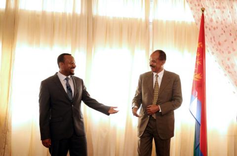 Eritrea's President, Isaias Afwerki, talks to Ethiopia's Prime Minister, Abiy Ahmed during the Inauguration ceremony marking the reopening of the Eritrean Embassy in Addis Ababa, Ethiopia July 16, 2018. REUTERS/Tiksa Negeri