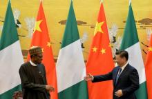 President of the Federal Republic of Nigeria, Muhammadu Buhari (L) and Chinese President, Xi Jinping shake hands during a signing ceremony at the Great Hall of the People in Beijing, April 12, 2016. PHOTO BY REUTERS/Kenzaburo Fukuhara