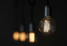 A bulb hangs inside a restaurant in Madrid, December 23, 2013. PHOTO BY REUTERS/Andrea Comas