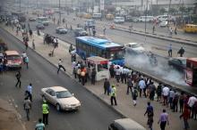 People queue as they wait for a commercial bus during the morning rush hour in Ojota district in Nigeria's commercial capital Lagos November 23, 2015. PHOTO BY REUTERS/Akintunde Akinleye