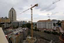 Construction is seen below the skyline of Johannesburg's upmarket Sandton suburb, February 5, 2016. PHOTO BY REUTERS/Mike Hutchings