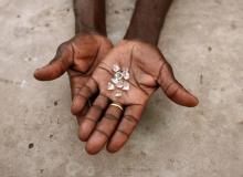 A diamond dealer from Zimbabwe displays diamonds for sale in Manica, near the border with Zimbabwe, September 19, 2010. PHOTO BY REUTERS/Goran Tomasevic