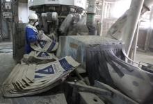 A factory worker rolls bags of cement at the East African Portland factory in Athi River near Kenya's capital Nairobi. PHOTO BY REUTERS/Noor Khamis