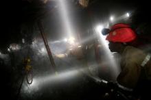 Mine workers employed at Sibanye Gold's Masimthembe shaft operate a drill in Westonaria, South Africa, April 3, 2017. PHOTO BY REUTERS/Mike Hutchings