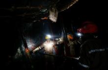 Mine workers employed at Sibanye Gold's Masimthembe shaft operate a drill in Westonaria, South Africa, April 3, 2017. PHOTO BY REUTERS/Mike Hutchings