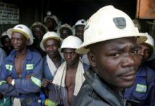 Konkola Copper Mines PLC workers wait in a lift before going to work underground in Konkola, April 12, 2005. PHOTO BY REUTERS/Stringer