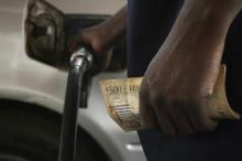 Motorists pumps fuel into his vehicle in the commercial capital Blantyre, March 26, 2012. PHOTO BY REUTERS/Eldson Chagara