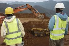 Employees stand in an open pit at Banro's Twangiza mine in eastern Congo, September 28, 2011. PHOTO BY REUTERS/Tom Kirkwood
