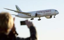 A plane spotter takes a picture of Ethiopian Airlines' 787 Dreamliner as it approaches runway 3 at Arlanda airport, north of Stockholm, Sweden, September 20, 2012. PHOTO BY REUTERS/Johan Nilsson/Scanpix Sweden