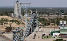 Employees walk under a concentrator at Ngezi platinum processing plant near Harare, November 28, 2013. PHOTO BY REUTERS/Philimon Bulawayo
