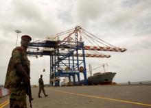A Djibouti policeman stands guard during the opening ceremony of Dubai-based port operator DP World's Doraleh container terminal in Djibouti port, February 7, 2009. PHOTO BY REUTERS/Ahmed Jadallah