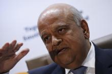 South Africa's Finance Minister, Pravin Gordhan gestures during a media briefing after he was reappointed to the position on Sunday night by President Jacob Zuma in Pretoria, South Africa, December 14, 2015. PHOTO BY REUTERS/Siphiwe Sibeko