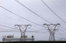 Pylons carry power from South Africa's Koeberg nuclear power plant near Cape Town August 13, 2015. PHOTO BY REUTERS