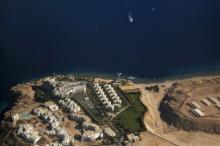 An aerial view of part of the Red Sea coast, with hotels and resorts in Sharm el-Sheikh, is seen through the window of an airplane, Egypt, December 7, 2015. PHOTO BY REUTERS/Amr Abdallah Dalsh
