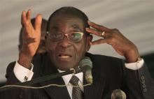 Zimbabwe President Robert Mugabe addresses a memorial service for retired general Solomon Mujuru at Ruzambo Farm in the Beatrice area, about 65 km (40 miles) south of the capital Harare, May 5, 2012. PHOTO BY REUTERS/Philimon Bulawayo