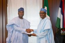 Nigeria's President Muhammadu Buhari (R) receive a letter of confirmation from the President of the Senate of Nigeria Bukola Saraki in Abuja, Nigeria, November 3, 2015. PHOTO BY REUTERS/Stringer