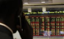 A stockbroker transacts shares during a trading session at the Nairobi Securities Exchange in Kenya's capital Nairobi, January 11, 2012. PHOTO BY REUTERS/Thomas Mukoya