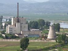 A North Korean nuclear plant is seen before demolishing a cooling tower (R) in Yongbyon