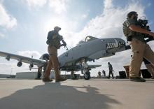 U.S. military personnel pass in front of a U.S. A-10 aircraft, one of a squadron that has arrived to step up the fight against the Taliban, at the Kandahar air base, Afghanistan, January 23, 2018. PHOTO BY REUTERS/Omar Sobhani