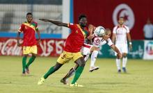 Tunisia's Wahbi Khazri and Guinea's Soumah Ibrahima Sory in action. PHOTO BY REUTERS/Zoubeir Souissi