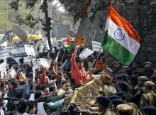 Activists from various Hindu right-wing groups shout slogans as they try to cross a police barricade during a protest against the students of Jawaharlal Nehru University (JNU) outside the university campus in New Delhi, India, February 16, 2016. PHOTO BY REUTERS/Anindito Mukherjee