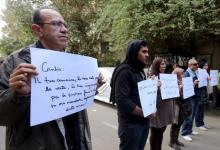 Activists hold placards that read, among others, "Giulio, one of us and killed like us", during a memorial for Giulio Regeni outside of the Italian embassy in Cairo, Egypt, February 6, 2016. PHOTO BY REUTERS/Mohamed Abd El Ghany