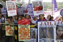 Activists participate in a protest to seek justice for a Filipino transgender Jeffrey Laude, who also goes by the name Jennifer, outside a justice hall where a preliminary investigation was held at Olongapo city, north of Manila, October 27, 2014. PHOTO BY REUTERS/Lorgina Minguito