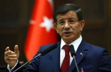 Turkey's Prime Minister Ahmet Davutoglu addresses members of parliament from his ruling AK Party (AKP) during a meeting at the Turkish parliament in Ankara, Turkey, June 30, 2015. PHOTO BY REUTERS/Umit Bektas